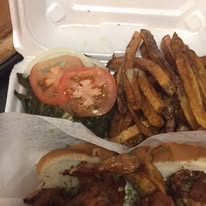 Fish sandwich with seasoned fries